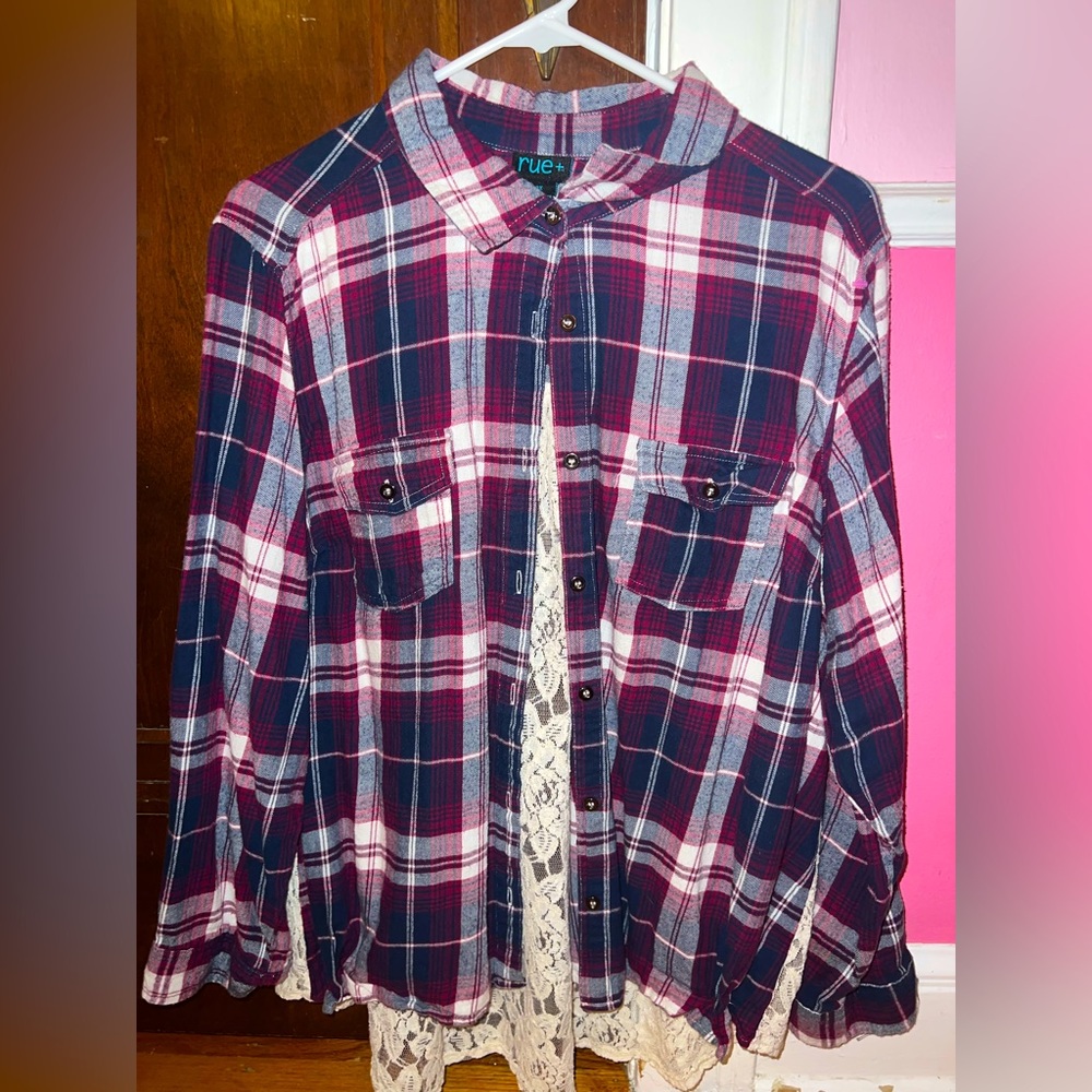 A cozy relaxed large flannel with white lace flowers on the back.